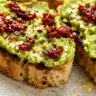 Transform Your Toast: Avocado & Sun-Dried Tomato Delight! - avocado toast - Avocado toast: transform your breakfast with this quick and healthy snack full of fl