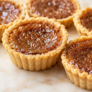 Heavenly Keto Butter Tarts: Your Sweet Escape! Keto Butter Tarts: bake this delicious, low-carb version of a classic Canadian dessert. Enjoy a rich, gooey, and