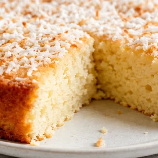 Keto Coconut Cake: Fluffy & Divine! Keto Coconut Cake: Bake this irresistibly moist and sugar-free cake. Perfect for low-carb diets, it's packed with tropical f
