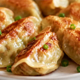 Crispy Pork Cabbage Dumplings - pork dumplings - Pork dumplings: master these savory, low-carb napa cabbage rolls. Pan-fried to golden perfection, a fantastic w