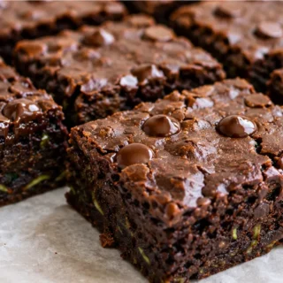 Fudgy Keto Zucchini Brownies: Healthy & Delicious! Keto Zucchini Brownies: bake these incredibly fudgy and moist treats. A secretly healthy dessert that's low-c