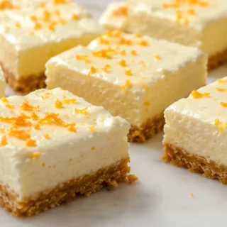 Dreamy Protein Cheesecake Bars - Protein Cheesecake Bars: bake this delicious low-carb recipe featuring a creamy filling and optional orange zest. Perfect for a